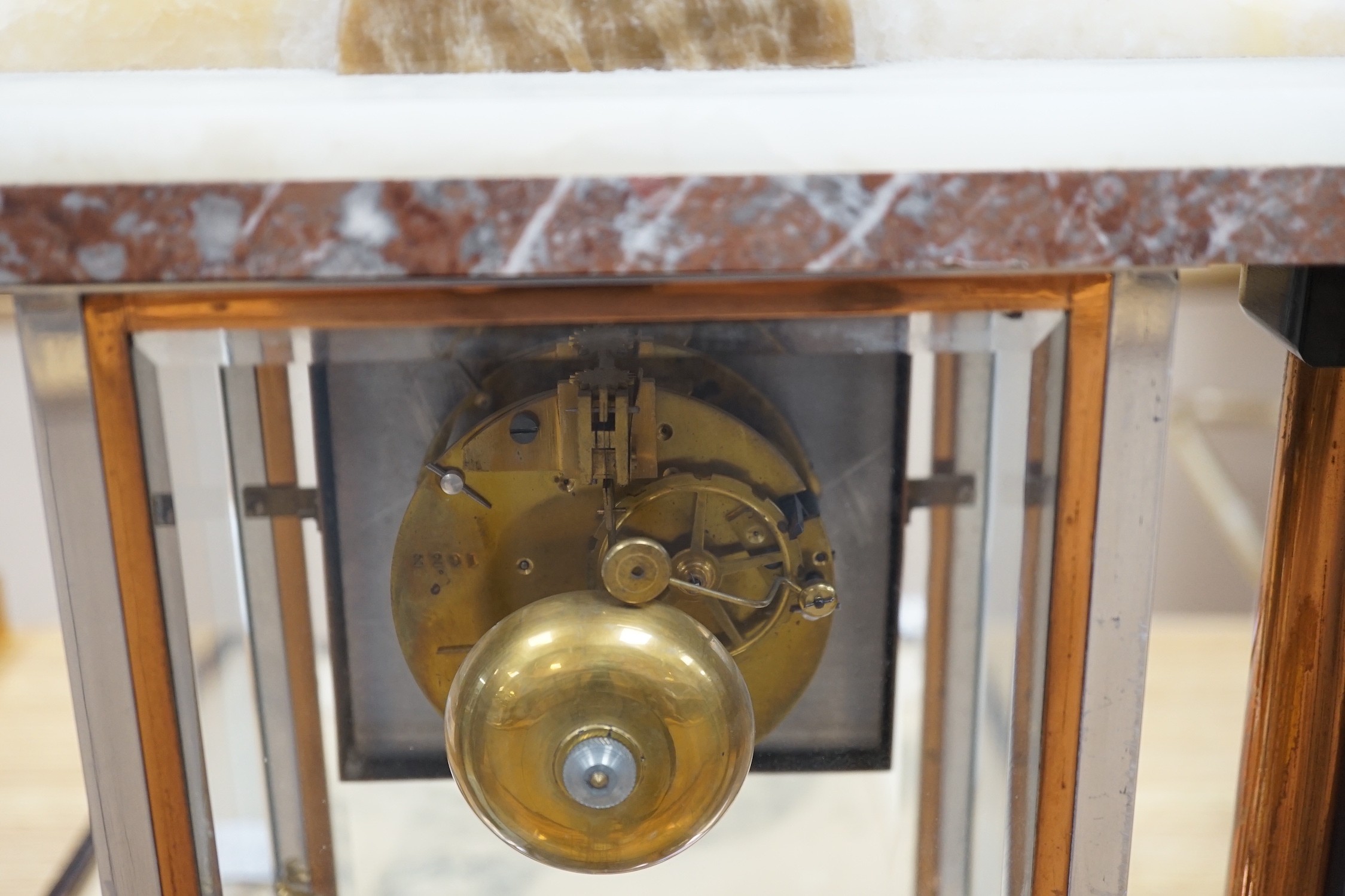 An Art Deco chrome, copper, brass and alabaster four glass mantel clock, 54cms wide